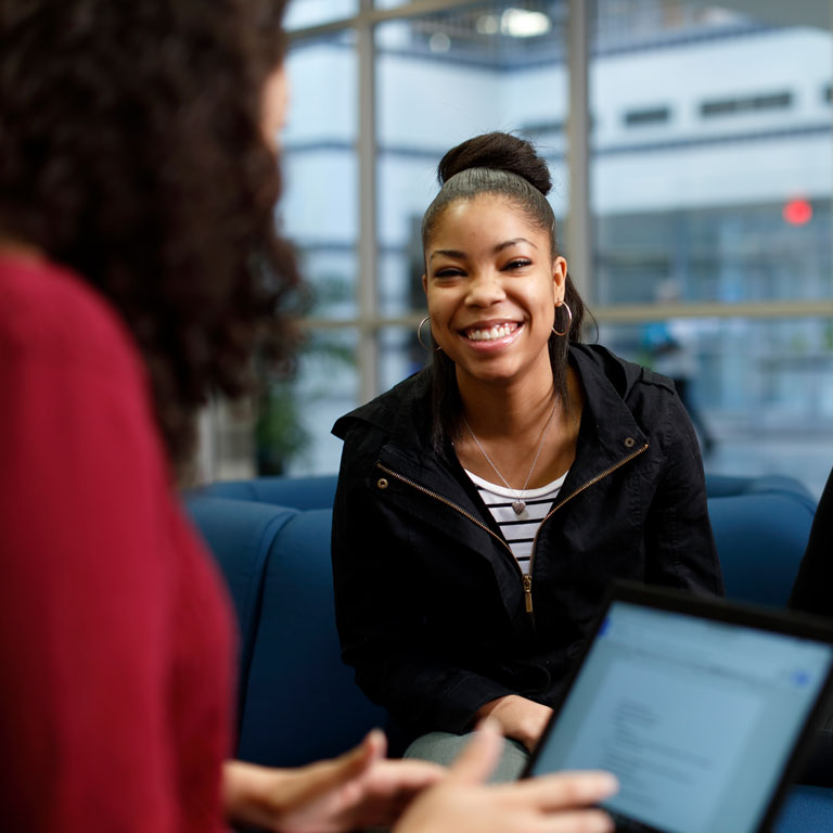 Female smiling, laughing.
